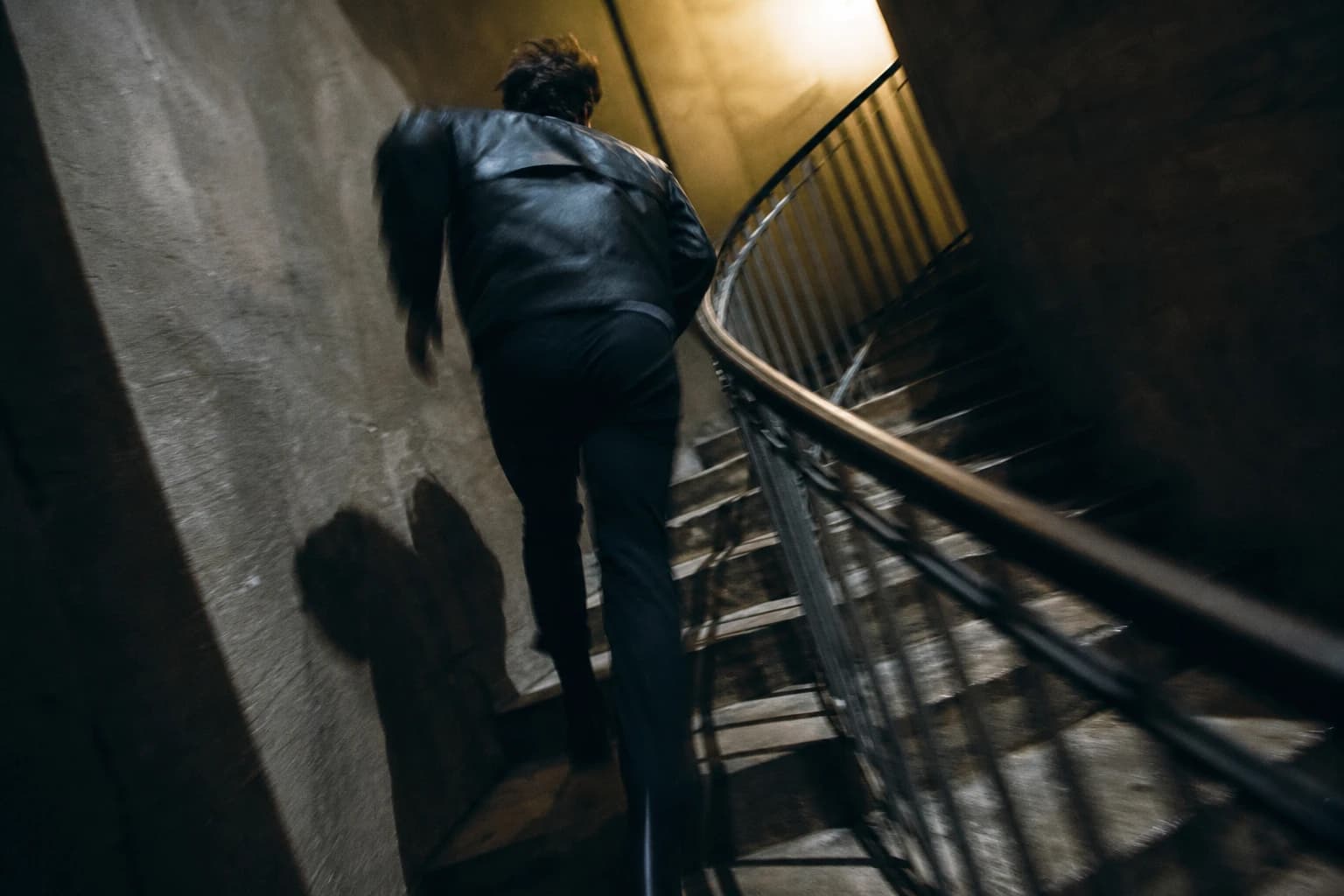 Dutch Angle Spiral Staircase Chase – AI Image Prompt